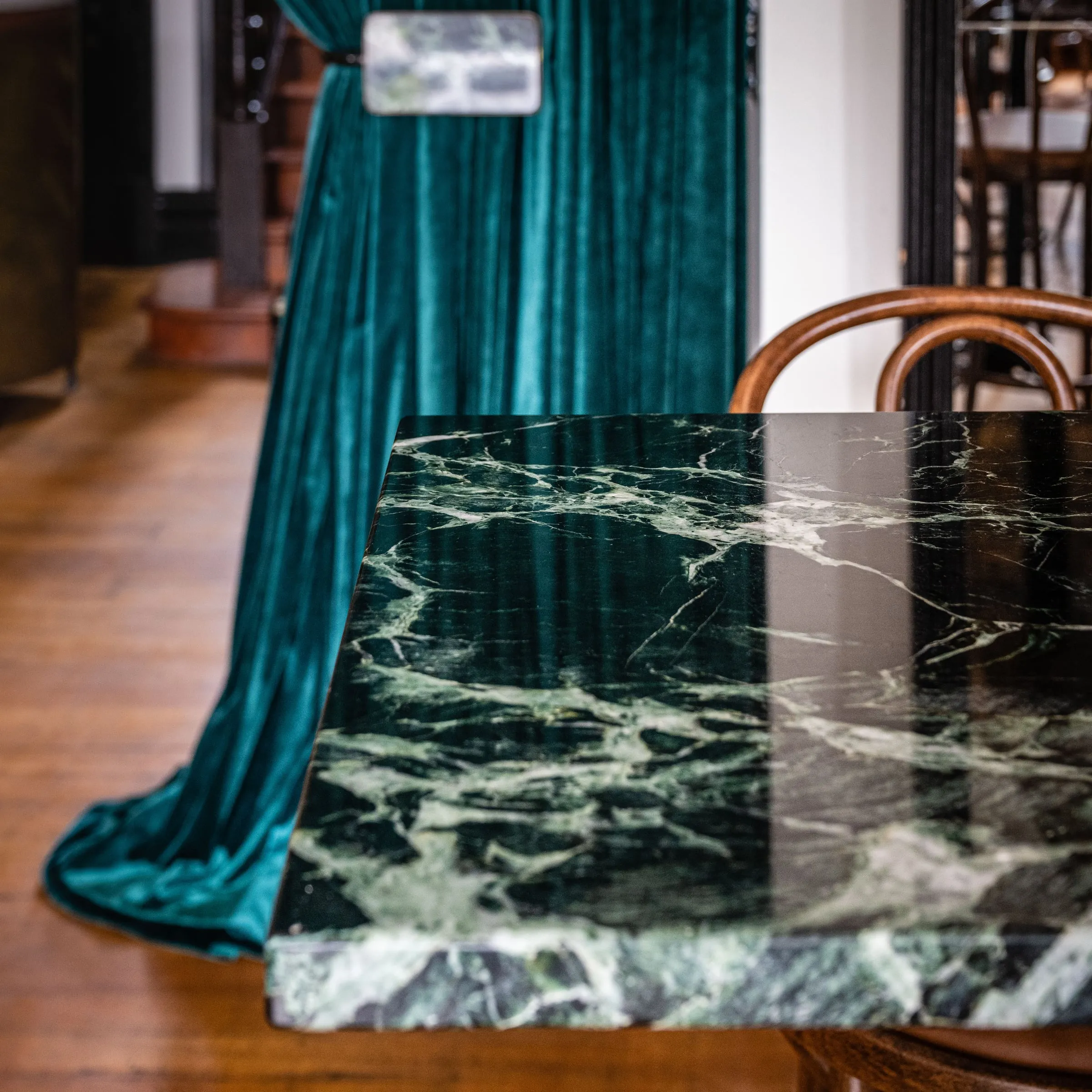 Polished Verde Antico leaner top with a crisp mitred edge