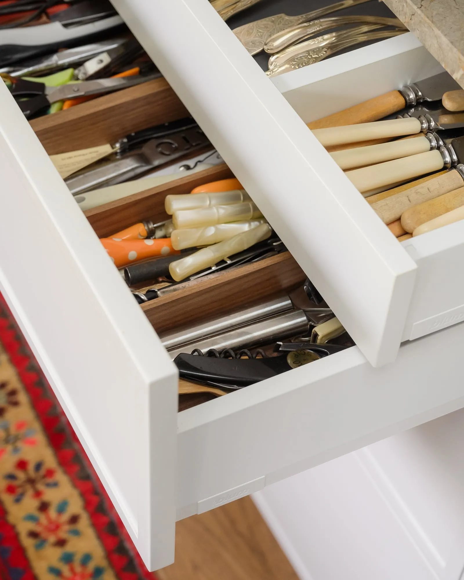 Double-tier drawer with Walnut cutlery dividers on white runners