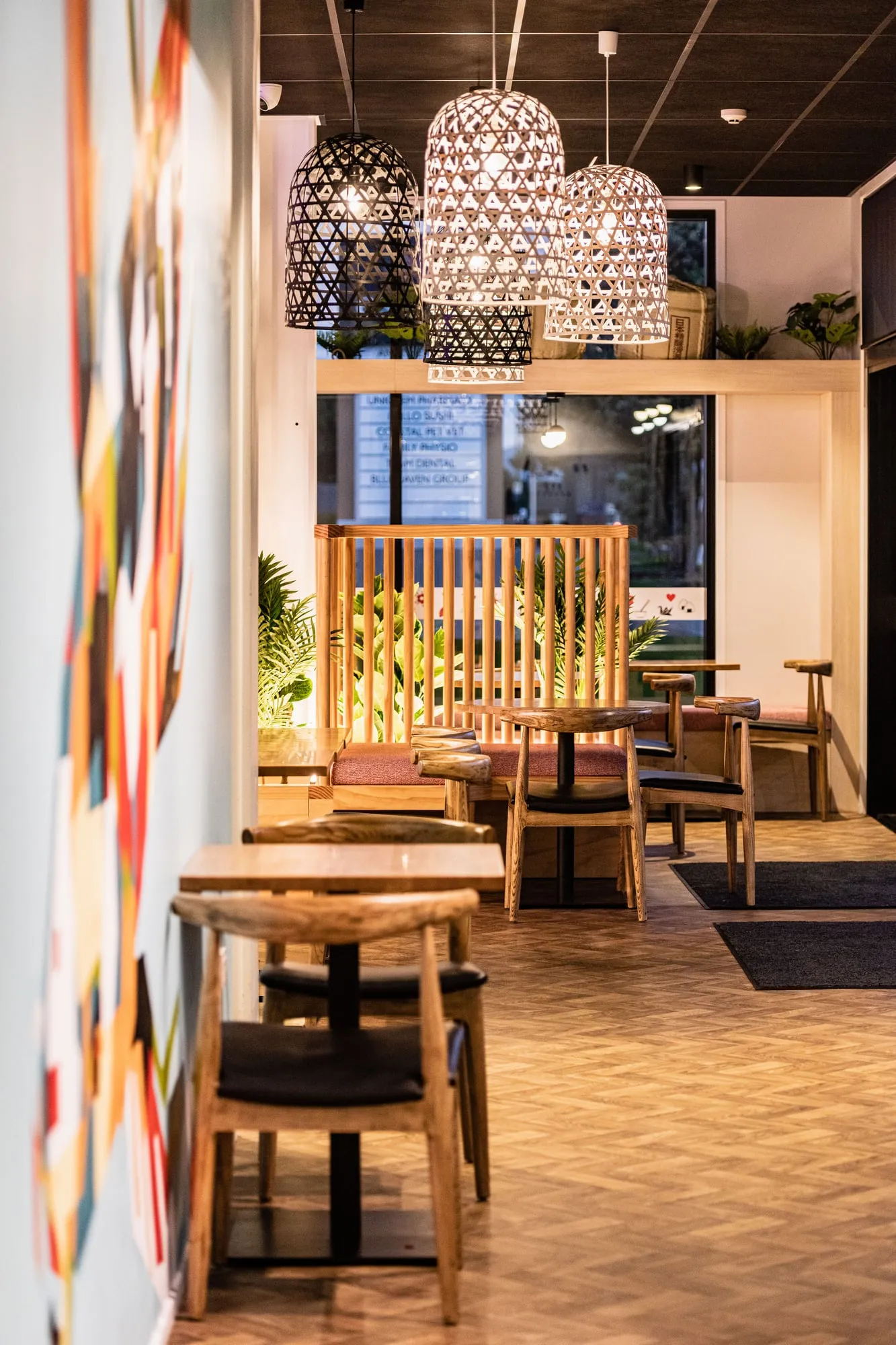 Vertical view down the dining room to the lantern cluster and dowel-screen booths