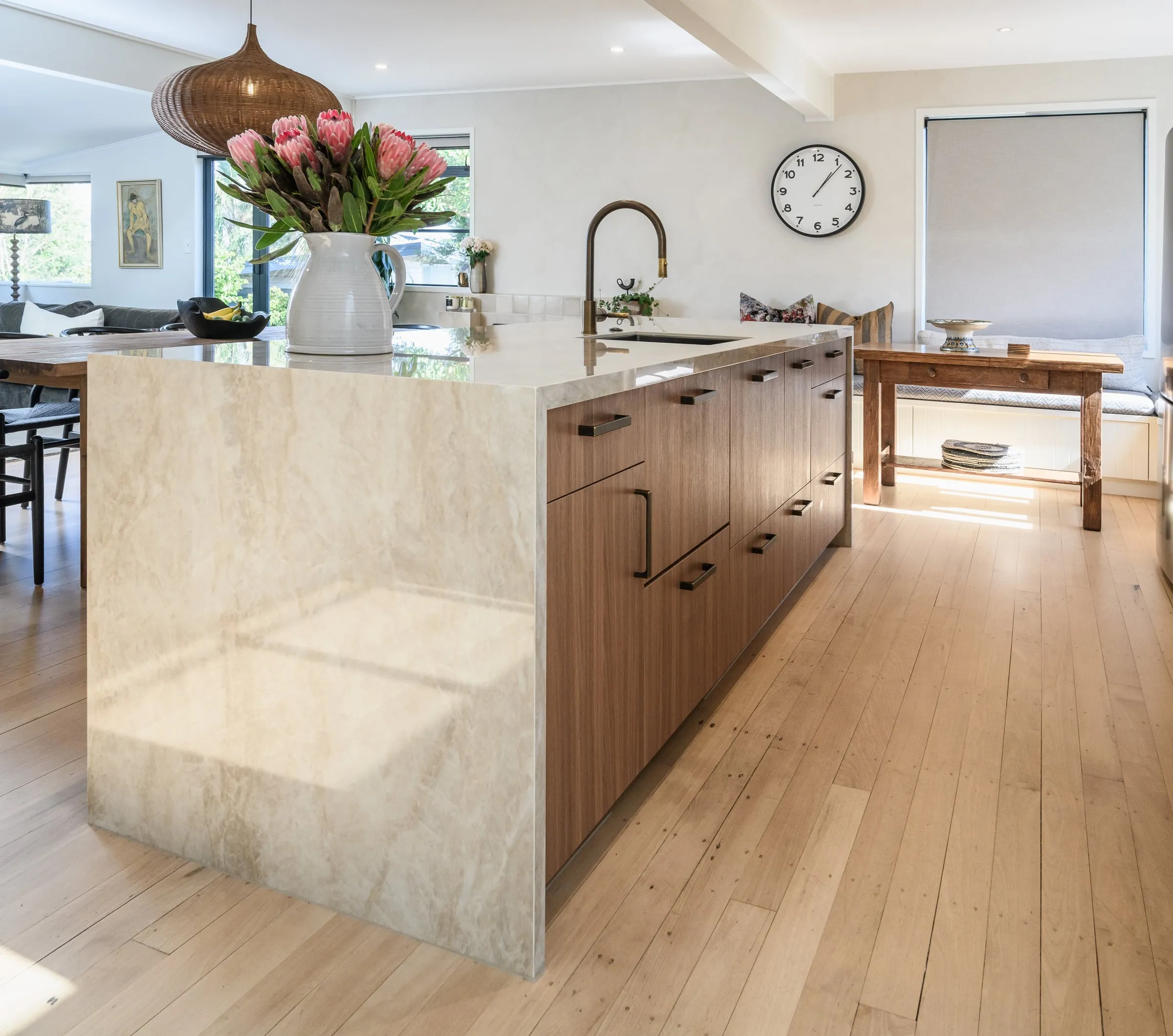 Mitred waterfall stone island with Walnut drawer fronts on the working side