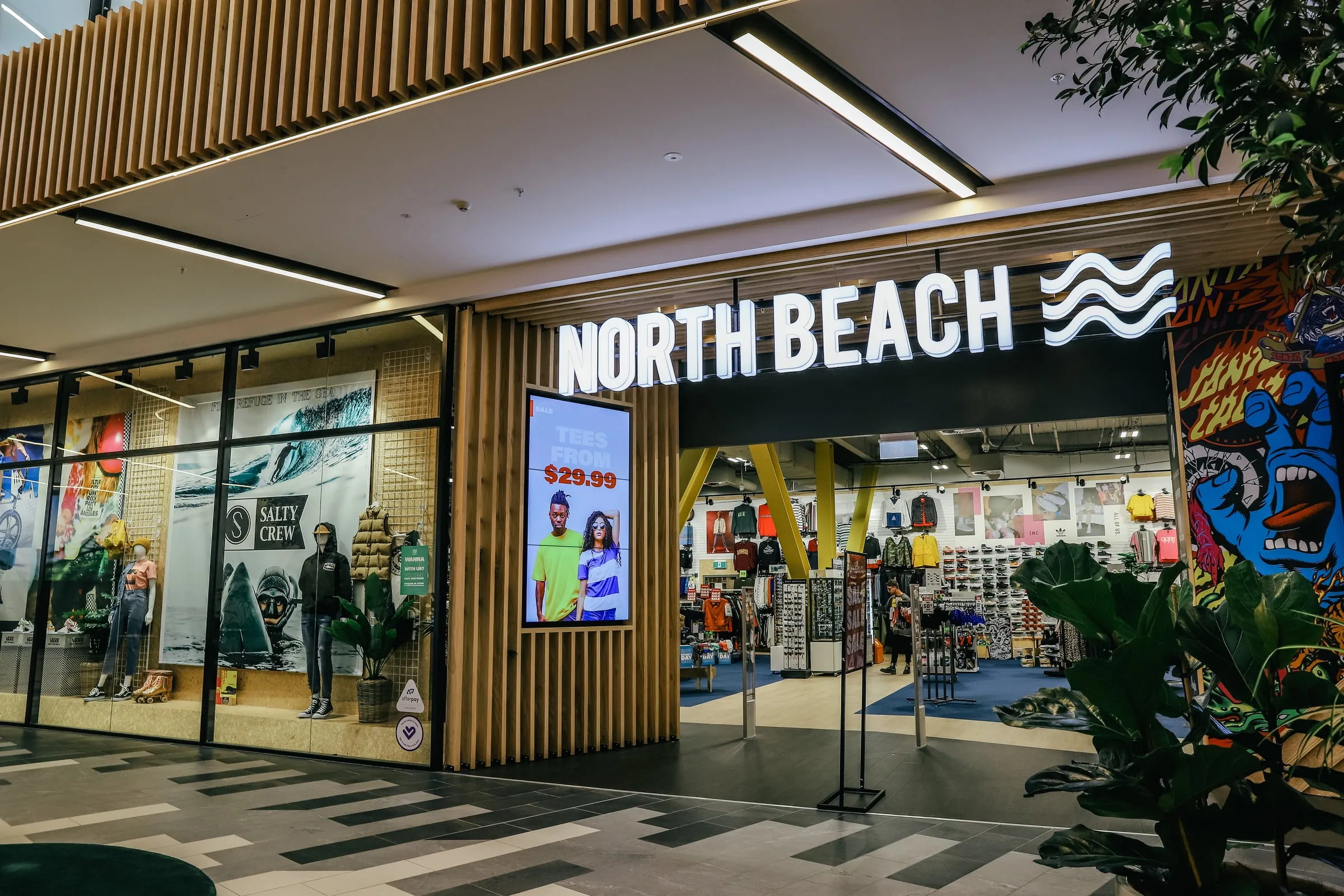 North Beach storefront portal with illuminated sign on Cedar batten fascia