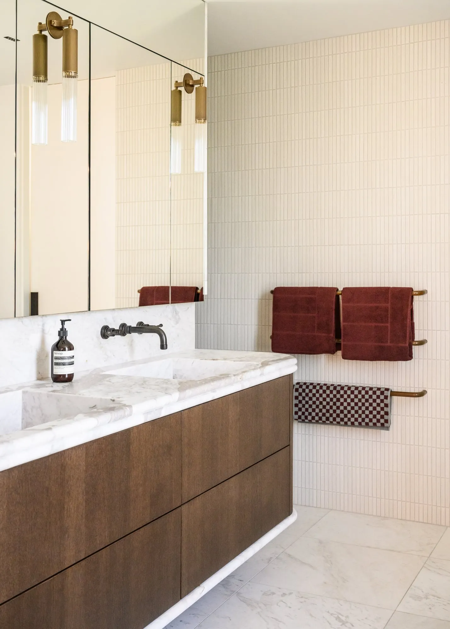 Walnut vanity with integrated Marble basins and ivory kit-kat tile